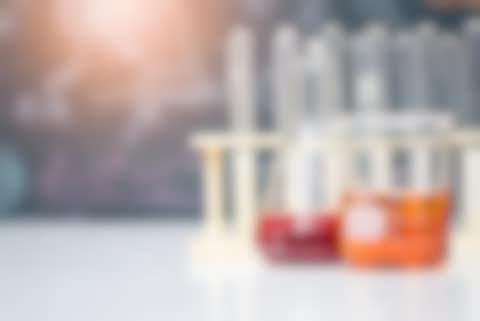 Scientific experiment Flasks with orange and red liquid